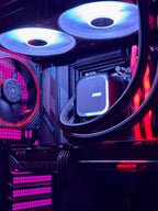Close-up of a computer motherboard with cooling components and RGB lighting.