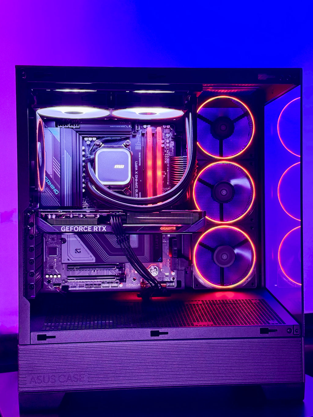 Glossy computer case with visible components and RGB lighting on a purple background
