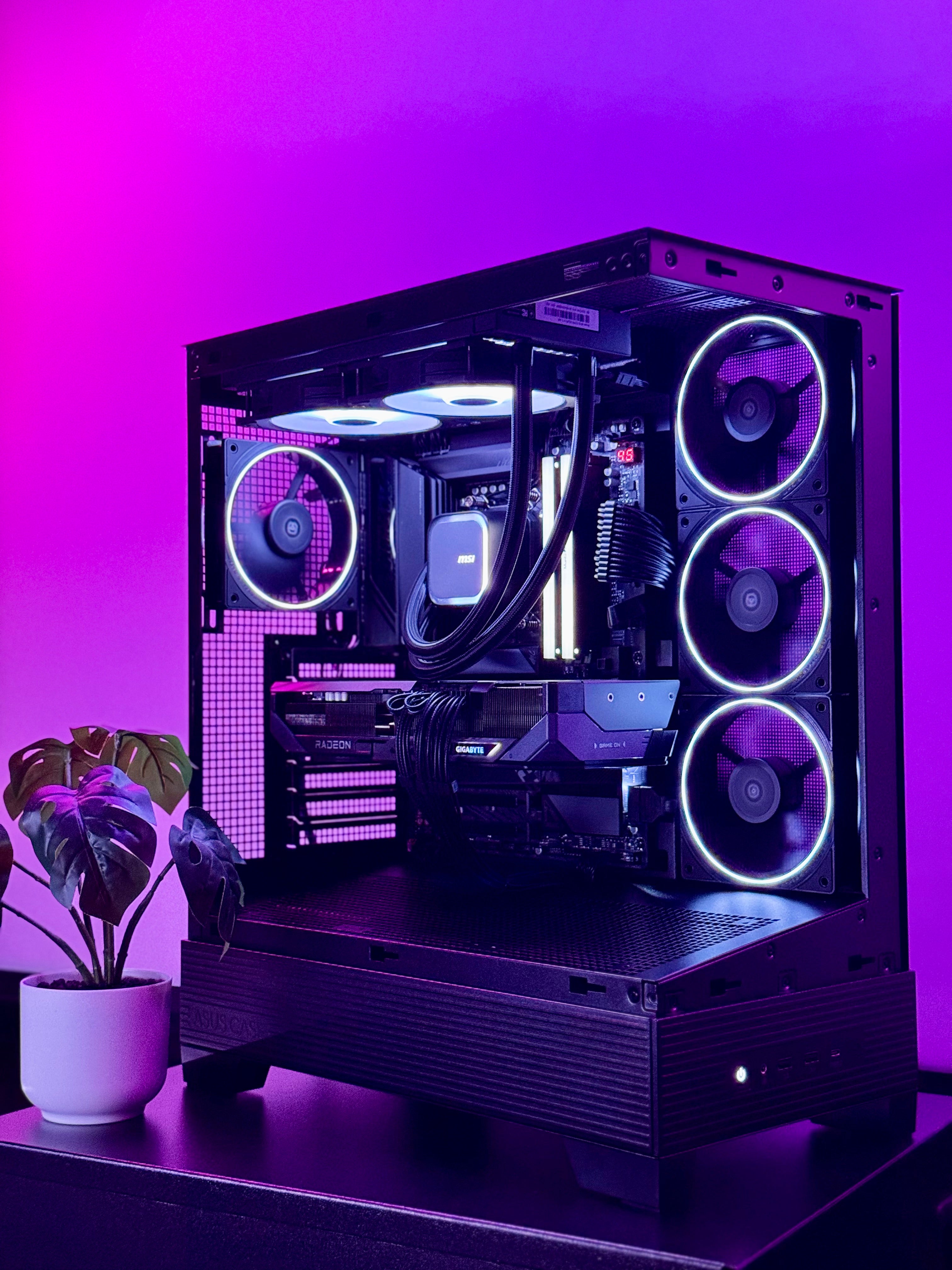 A futuristic black gaming pc with tasteful white RGB accents by Shook PC with a 9070 XT and 9800X3D gaming CPU