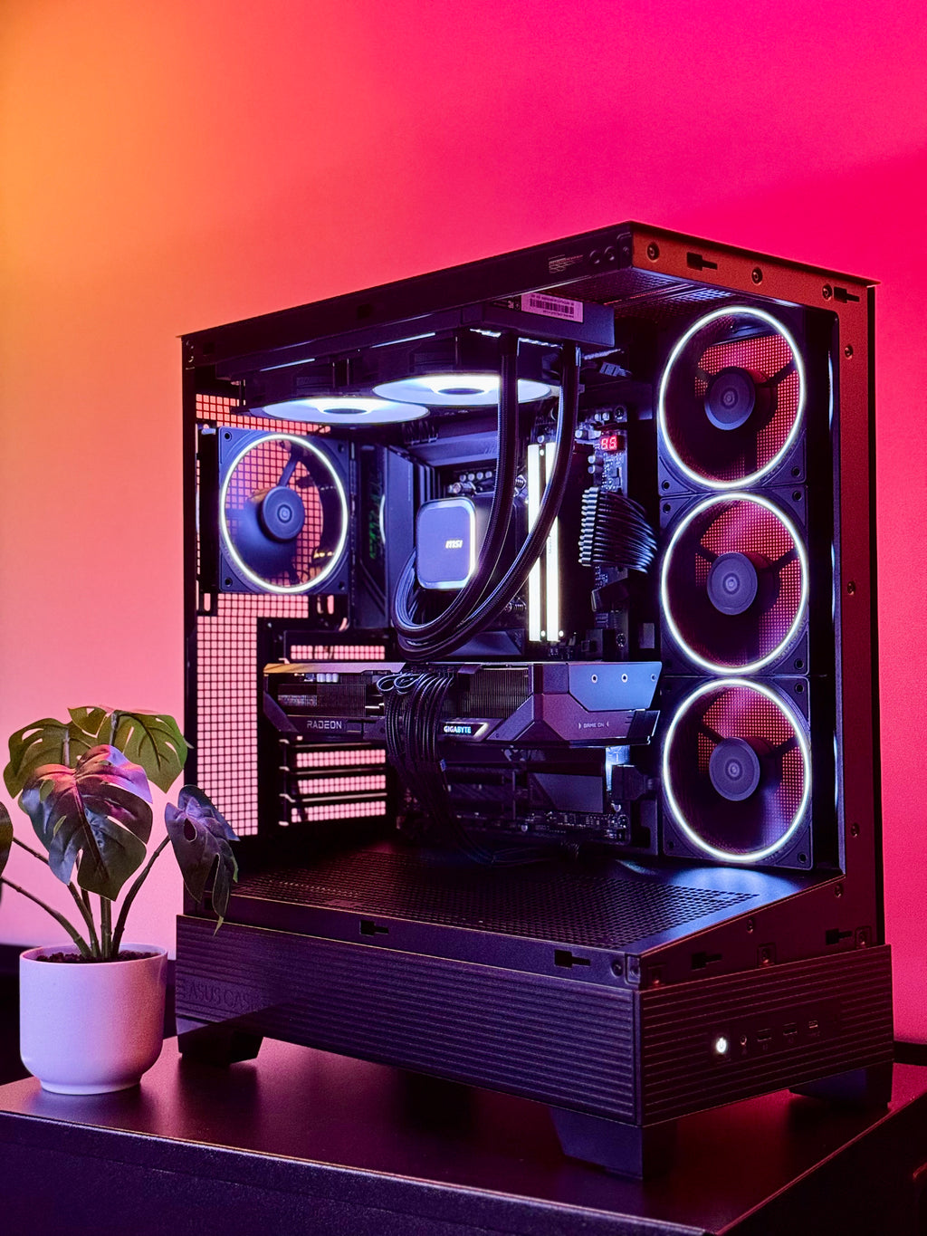 A futuristic black gaming pc with tasteful white RGB accents by Shook PC with a 9070 XT and 9800X3D gaming CPU