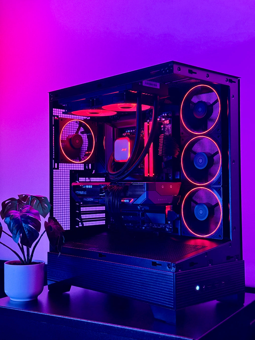 A futuristic black gaming pc with tasteful white RGB accents by Shook PC with a 9070 XT and 9800X3D gaming CPU