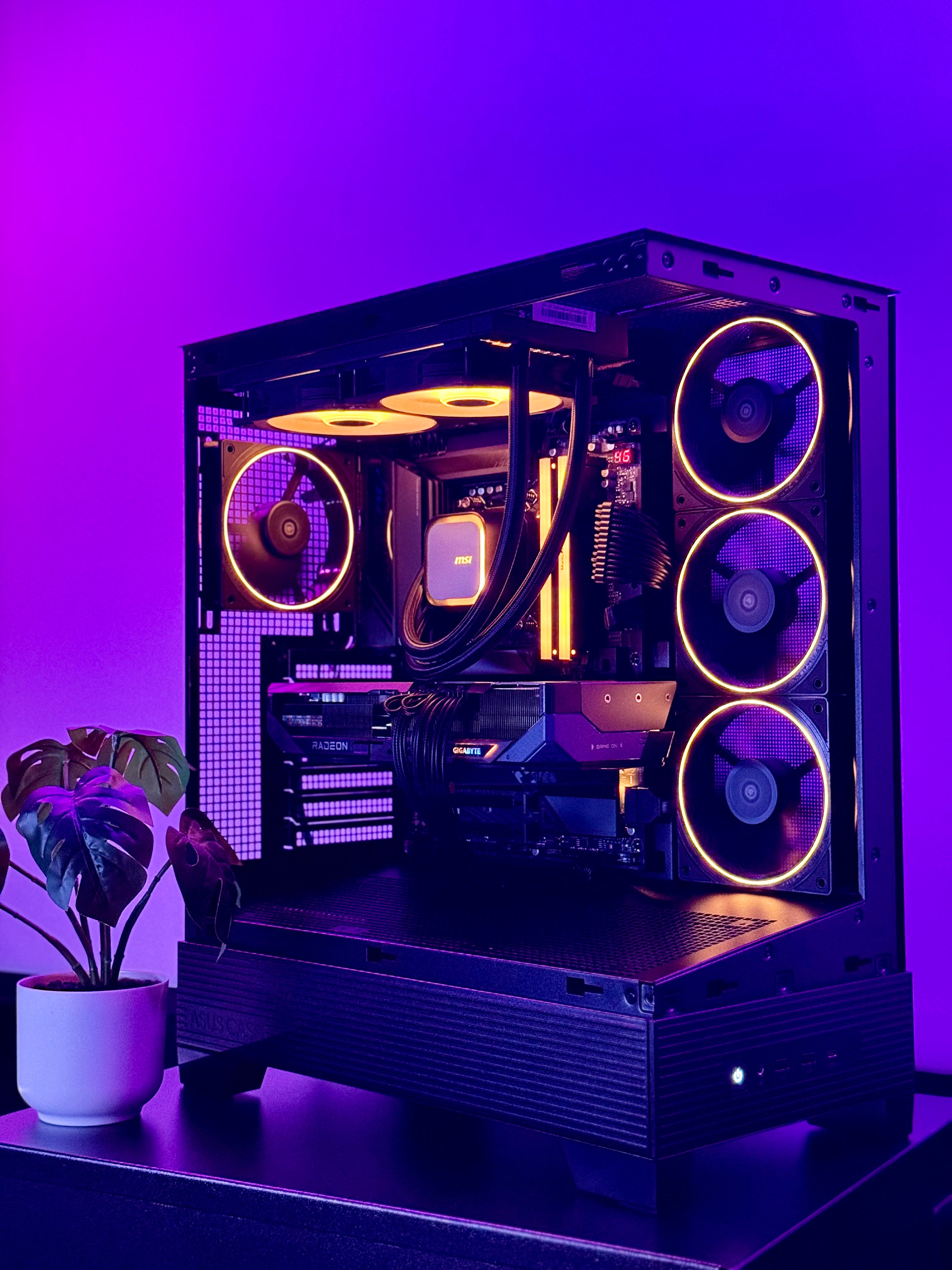 A futuristic black gaming pc with tasteful white RGB accents by Shook PC with a 9070 XT and 9800X3D gaming CPU