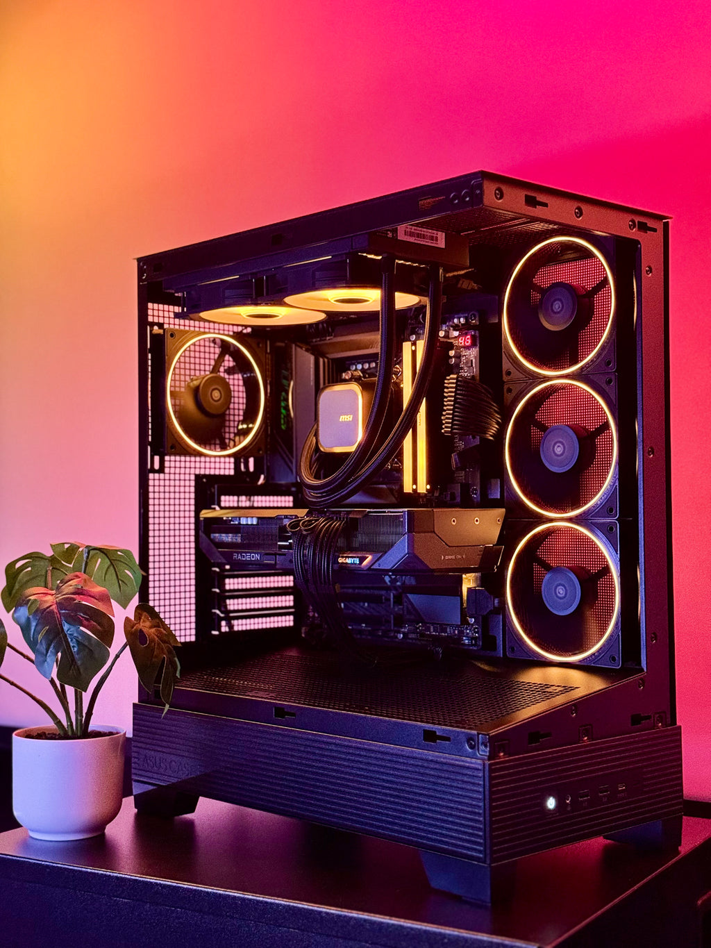 A futuristic black gaming pc with tasteful white RGB accents by Shook PC with a 9070 XT and 9800X3D gaming CPU