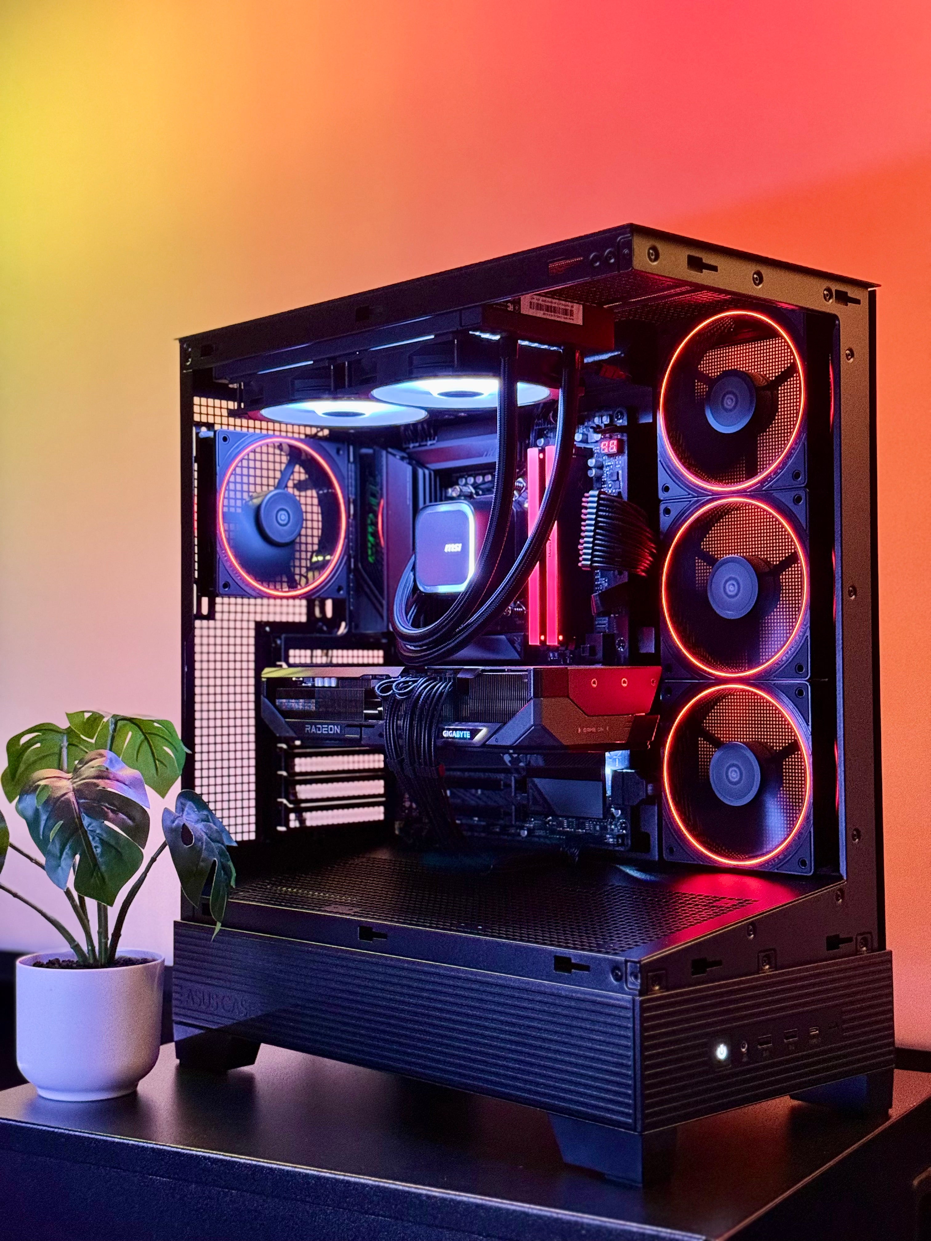 A futuristic black gaming pc with tasteful white RGB accents by Shook PC with a 9070 XT and 9800X3D gaming CPU
