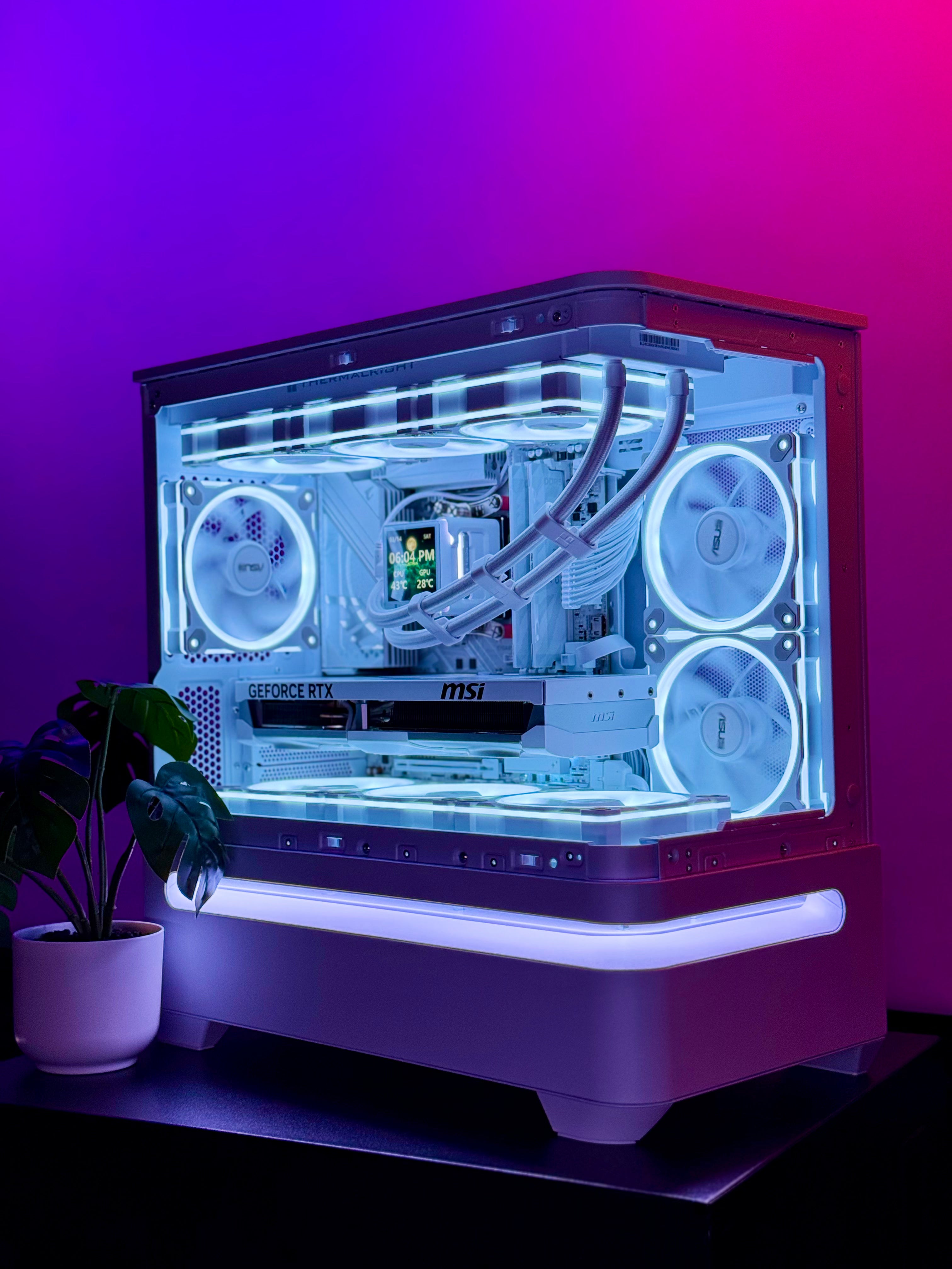 Computer case with transparent side panel on a purple gradient background