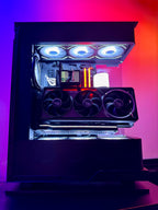 Glossy gaming PC case with RGB lighting on a gradient purple and orange background
