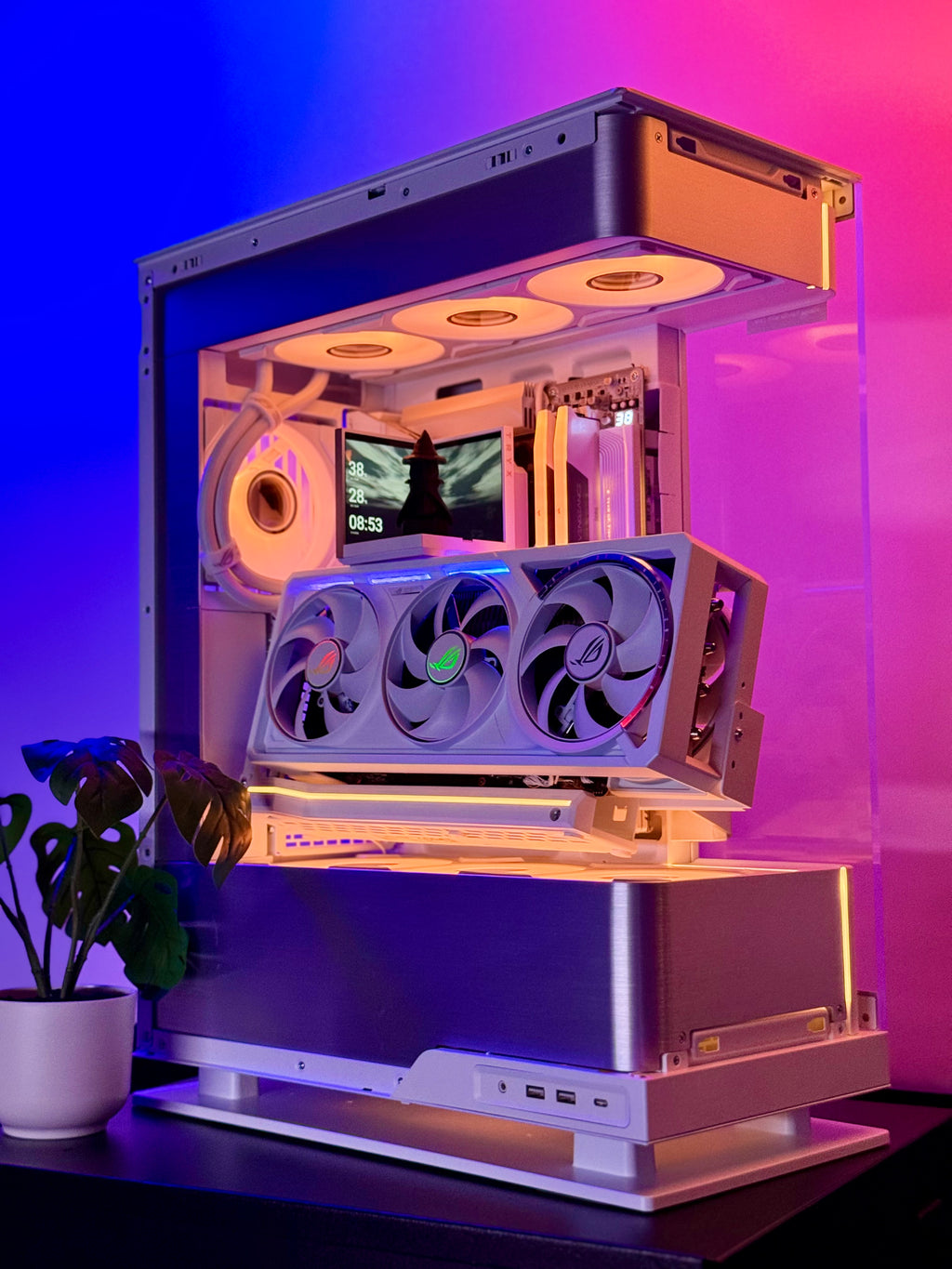 Open computer case with visible components on a purple and pink gradient background