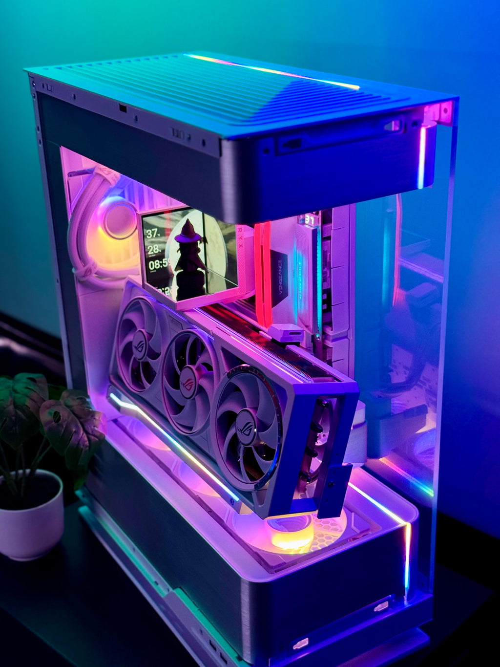 Glossy computer case with RGB lighting on a dark surface
