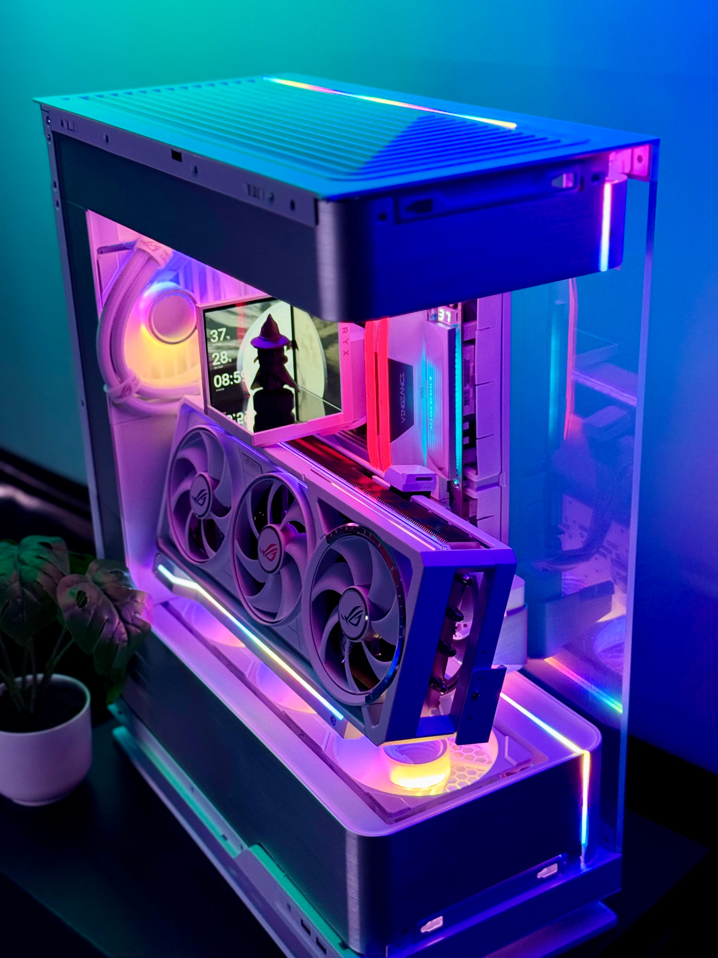 Glossy computer case with RGB lighting on a dark surface