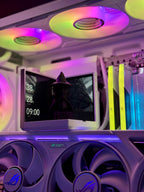 High-tech computer setup with RGB lighting and a monitor displaying a dark-themed wallpaper.
