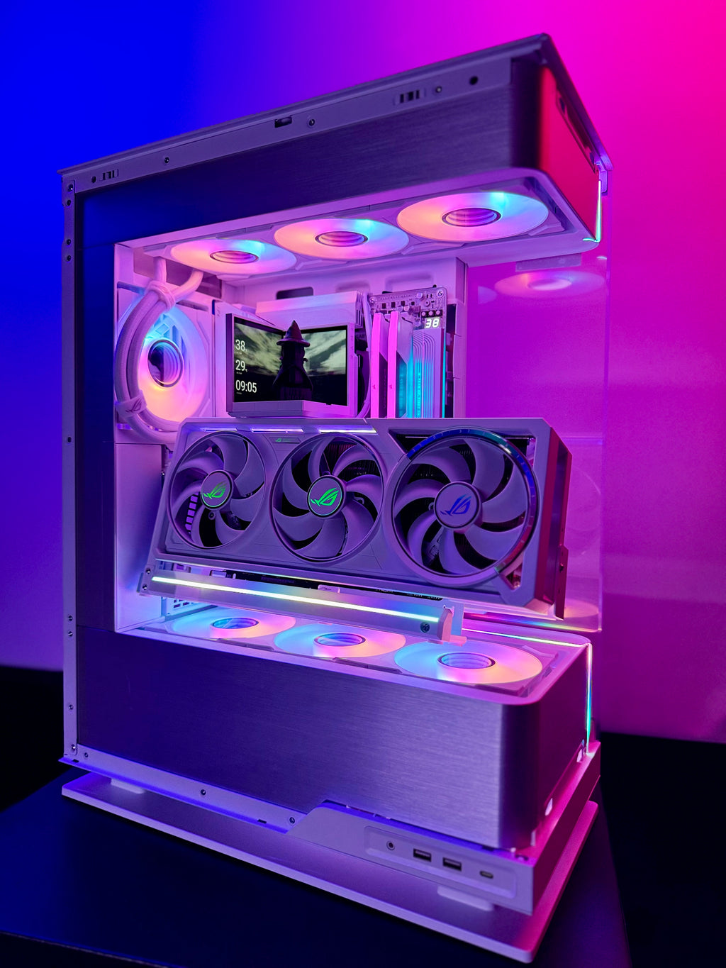 Open computer case with RGB lighting on a dark background