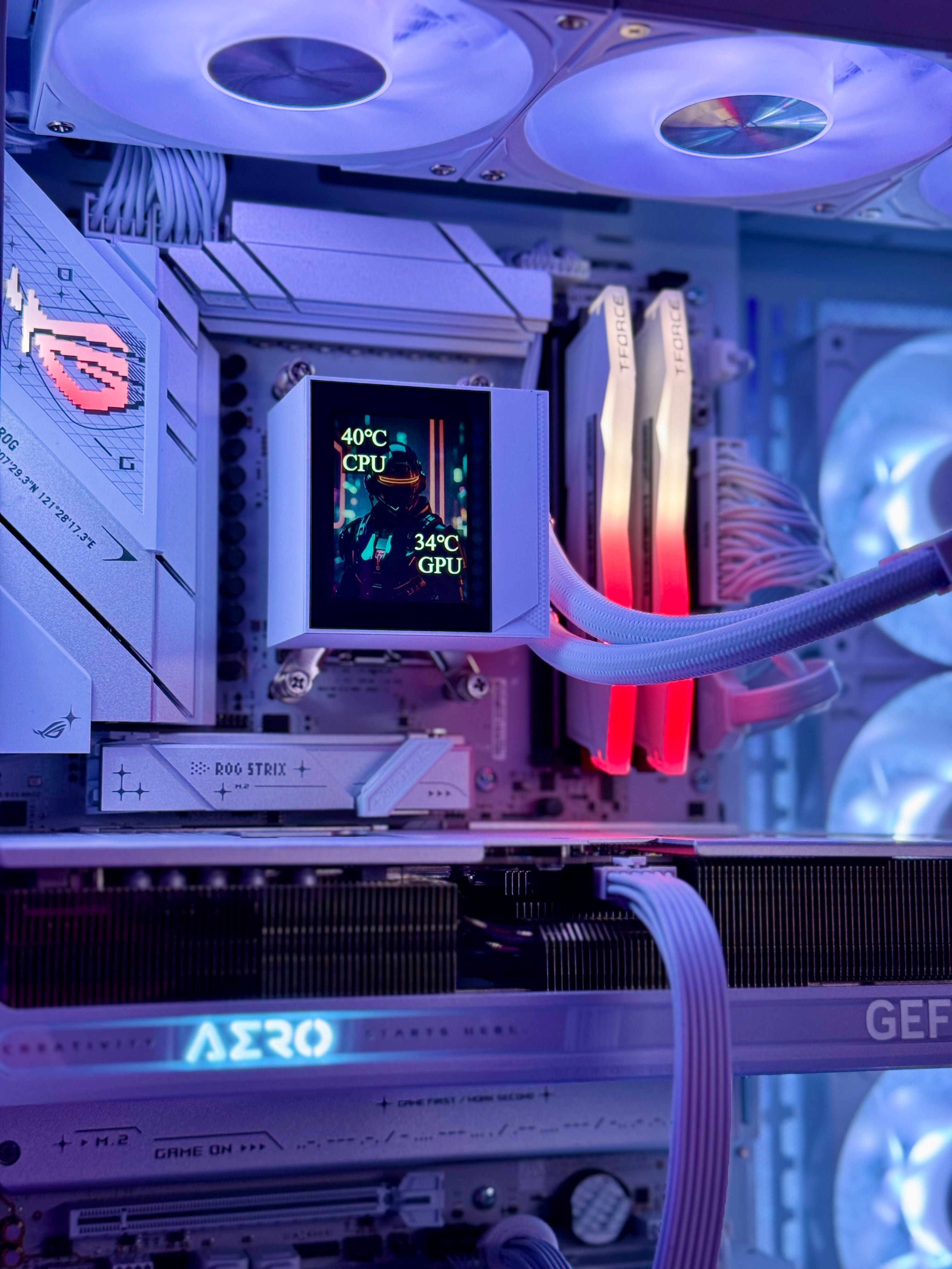Close-up of a computer motherboard with cooling system and RGB lighting