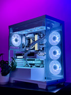A custom-built desktop PC inside a transparent side-panel computer case, illuminated with cool white and blue LED lighting, set against a vibrant purple and blue background.