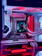 Close-up of a high-performance custom PC build featuring a white ASUS ROG Maximus Z790 motherboard, an ASRock Steel Legend RTX 4090 graphics card, a custom liquid CPU cooler with a central display screen showing a futuristic character, and RGB LED lighting in red and purple.