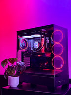 Computer case with RGB lighting on a pink and purple gradient background